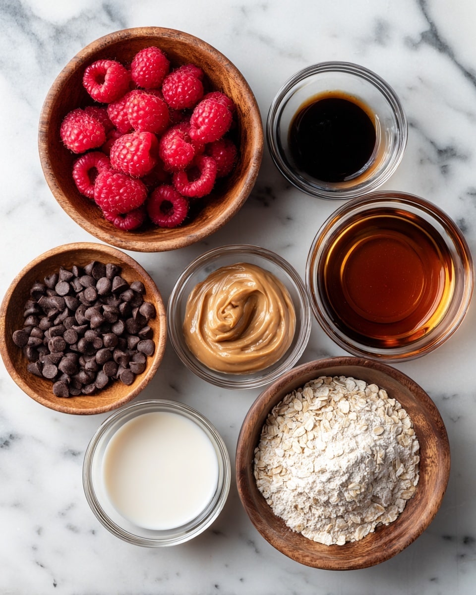 The image shows eight small bowls arranged on a white marbled surface, each containing different ingredients. Starting from the top left, there is a wooden bowl filled with bright red raspberries, next to it on the right is a small clear glass bowl with dark brown vanilla extract. Below the vanilla, there is another wooden bowl filled with shiny dark chocolate chips. In the middle row, from left to right, there is a clear glass bowl with smooth, light brown peanut butter, a clear glass bowl with dark cocoa powder that has a crumbly texture, and a small white bowl with light beige milk. At the bottom, a clear glass bowl is filled with off-white oat flour with a slightly rough texture, and to its right, a white bowl holds dark amber maple syrup. The bowls are placed closely together and the photo is taken with an iphone --ar 4:5 --v 7