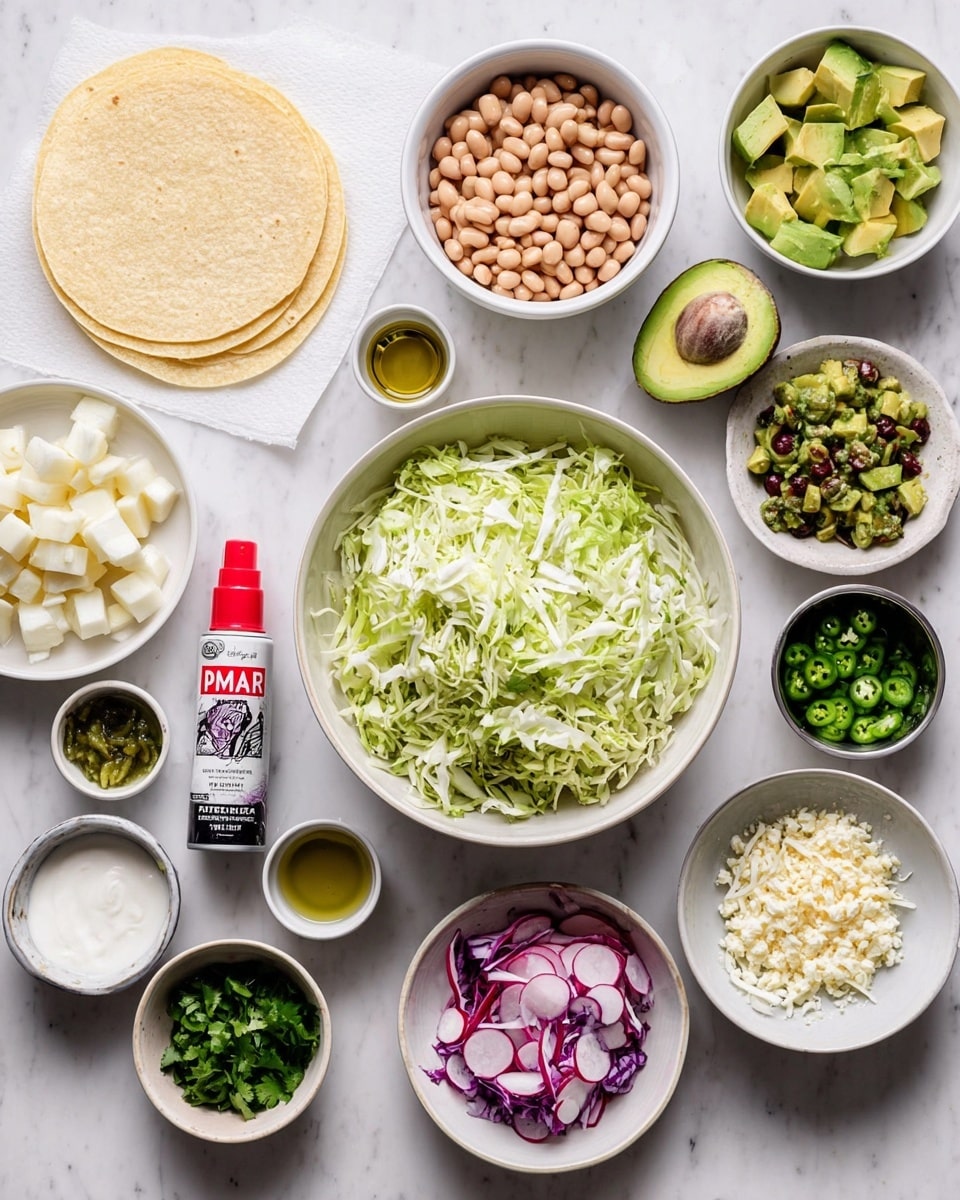 The image shows many small white bowls and plates on a white marbled surface, each filled with different ingredients. The center has a large white bowl with shredded green and purple cabbage. Around it, there are white bowls of light brown beans at the top right, bright green diced avocado, thinly sliced red onions, and sliced radishes below. There is also a bowl with green chopped herbs, a bowl of white cheese crumbles, and a small dish with chopped green peppers. On the left side, a plate holds small white cubes of jicama, and a small cup has white sour cream with a little dish of minced garlic next to it. A small bowl contains pepitas, and another has green chopped cilantro. A can of avocado oil spray with a red cap is placed centrally beside the ingredients. In the top left, four corn tortillas sit stacked on white paper. The whole scene is bright and fresh with a variety of colors and textures, photo taken with an iphone --ar 4:5 --v 7