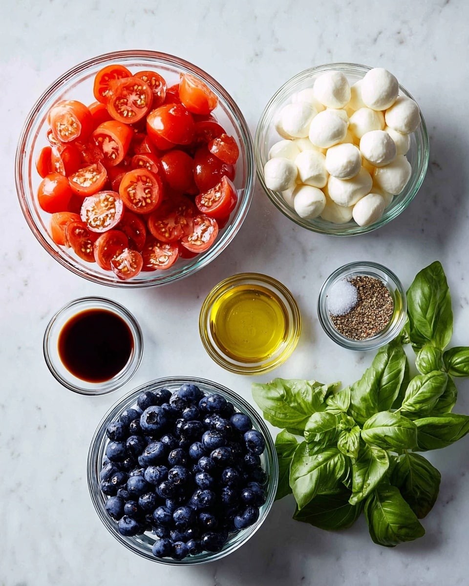 Five clear glass bowls and some fresh green basil leaves are placed on a white marbled surface. The largest bowl, at the top left, is filled with bright red cherry tomatoes, sliced in half, showing their juicy inside with seeds and flesh. Below it, a smaller bowl holds fresh, small white mozzarella balls, smooth and round. To the right of the mozzarella, another clear bowl is full of dark blue blueberries with a slightly frosted look. Above the blueberries, a small bowl of light golden olive oil is placed, clear and shiny. Next to the olive oil, on the upper right, a small clear bowl contains half white salt and half black pepper, split evenly. Near the bottom left, a small bowl contains a dark brown liquid, likely balsamic vinegar, smooth and glossy. The fresh basil leaves, deep green with smooth edges, lie on the surface at the bottom right. photo taken with an iphone --ar 4:5 --v 7