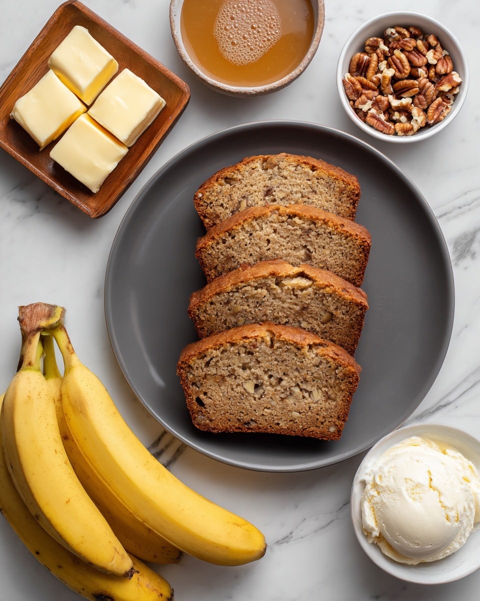 The image shows a dark gray plate with five slices of banana bread stacked slightly on top of each other, each slice light brown with tiny banana bits visible inside. Above the plate, there is a small wooden dish holding four square slices of pale yellow butter. To the right of the butter, there is a small white bowl filled with chopped pecans, showing brown and cream-colored pieces. Next to the pecans, a larger white bowl contains smooth caramel sauce in a golden caramel color with a few small bubbles on the surface. Below the plate, there are three yellow bananas with some dark spots on their skin, placed side by side. To the right of the bananas, there is a white container of vanilla bean ice cream with a blue lid and blue text, showing a vanilla flower and bean pods on the label. Everything is arranged on a white marbled surface. Photo taken with an iphone --ar 4:5 --v 7