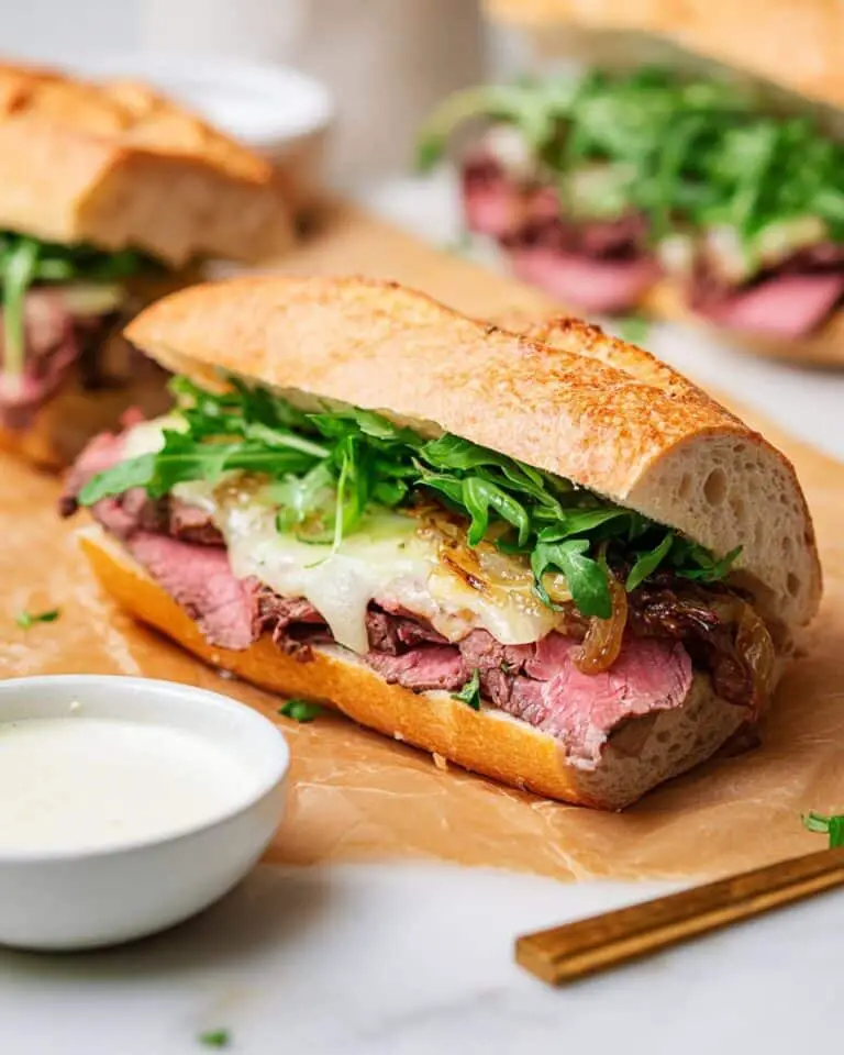 Prime Rib Sandwich with Caramelized Onions, Provolone, and Arugula Recipe