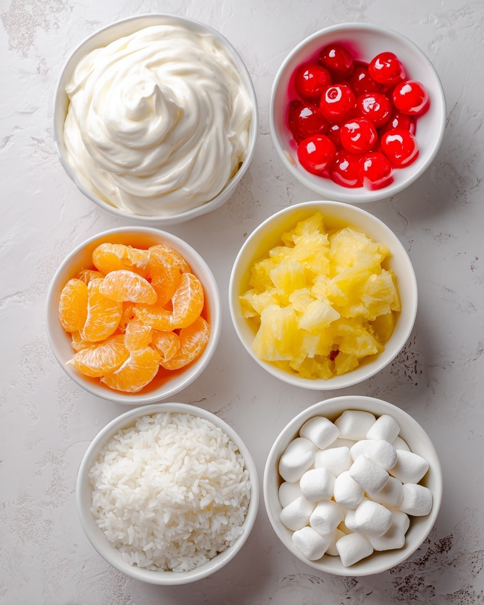 The image shows six white bowls placed on a white marbled surface. The largest bowl at the top left has smooth, white cool whip with a creamy texture. To the right of it is a smaller bowl filled with bright red maraschino cherries that look shiny and round. Below the cherries is a bowl filled with pale yellow crushed pineapple that has a soft, slightly fibrous texture. On the bottom left is a bowl with white rice, fluffy with visible grains. Above the rice is a bowl of bright orange mandarin orange segments that look juicy and plump. Finally, at the bottom right is a bowl filled with small, white marshmallows that are puffy and smooth. photo taken with an iphone --ar 4:5 --v 7