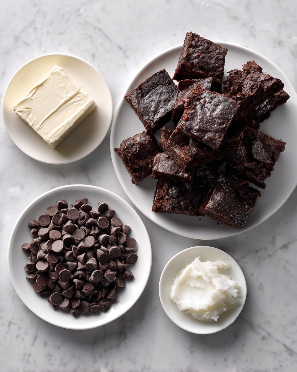 A top view of four white plates on a white marbled surface, each containing different ingredients. The top right plate is full of many rough-textured, dark brown brownie pieces stacked unevenly. Below and to the left, a smaller plate holds a smooth, block of white cream cheese. Another white plate at the bottom center is filled with many small, shiny dark chocolate chips that have a rounded, slightly pointy shape. To the right of that, a small white plate contains a dollop of white coconut oil with a soft, creamy texture. photo taken with an iphone --ar 4:5 --v 7