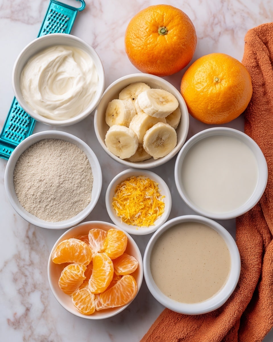 The image shows eight small white bowls arranged on a white marbled surface with an orange cloth in the top right corner and two whole oranges placed near the top center. Each bowl contains a different ingredient: one has white vanilla yogurt with a smooth texture, another has frozen banana slices covered lightly with frost, a third contains a light tan powder labeled vanilla protein powder, a fourth holds peeled orange segments with a bright orange and juicy look, a fifth bowl shows beige vanilla extract with a slightly thick liquid texture, the sixth has smooth white milk, and the seventh contains a small amount of orange zest finely grated. A turquoise grater is positioned on the left side next to the orange zest bowl. Photo taken with an iphone --ar 4:5 --v 7