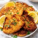 Crispy Chicken Schnitzel with Lemon Wedges Recipe
