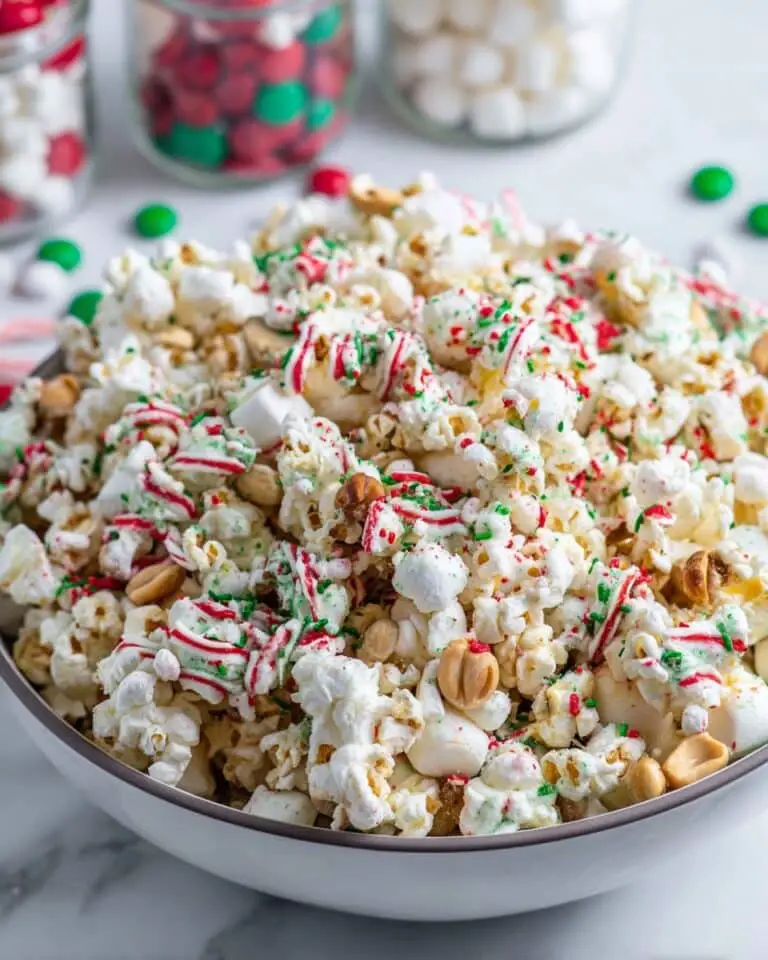 White Chocolate Christmas Popcorn with Peanuts, Marshmallows, and Festive Drizzles Recipe