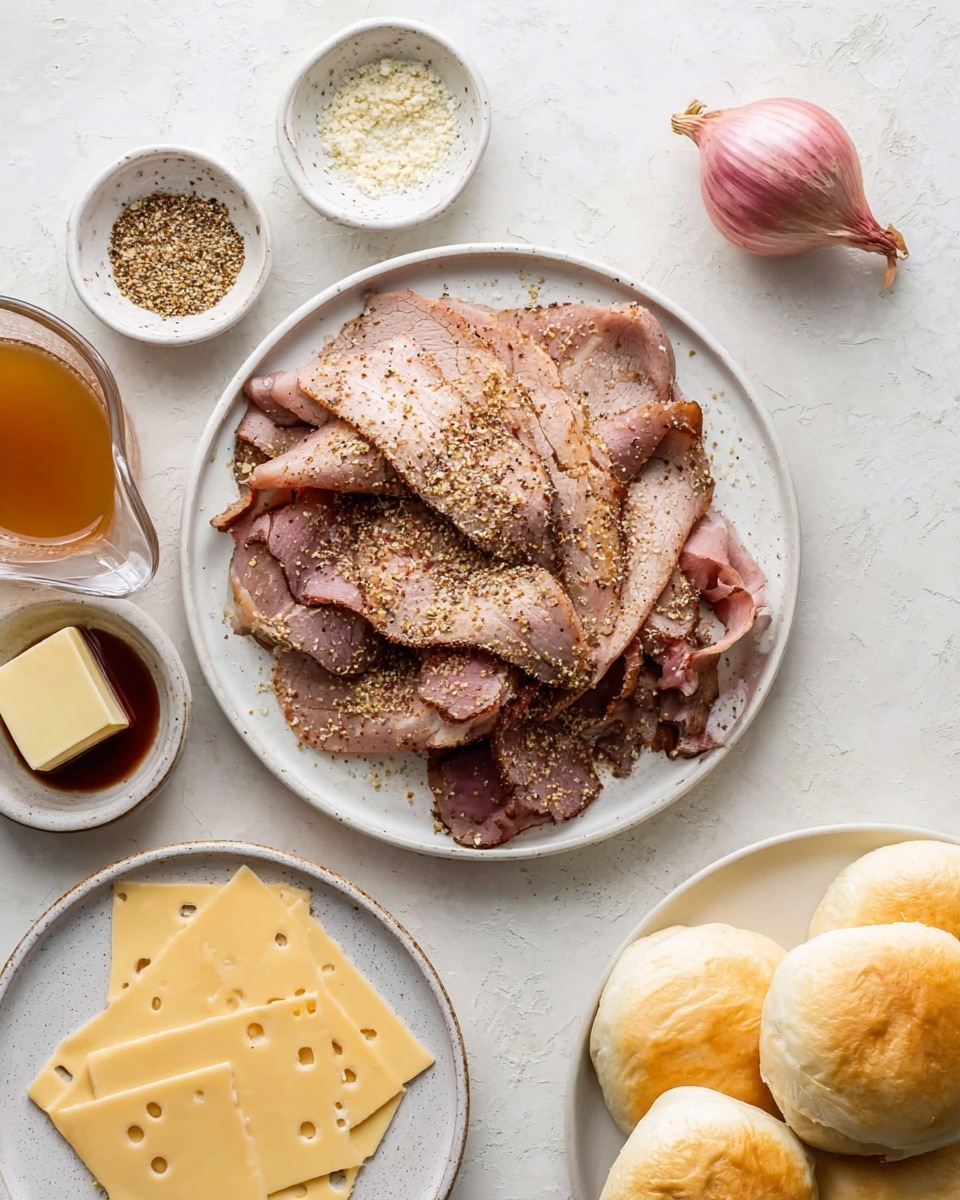A white speckled plate holds a pile of thinly sliced roast beef, light brown with darker edges, sprinkled with coarse seasoning. Around it are small white speckled bowls containing coarse seasoning mix, a square of butter, and a small amount of dark brown sauce. Below the plate, another white speckled plate shows several thin, pale yellow cheese slices with small holes. To the top right, a group of five small white rolls with light golden tops rests on a white marbled surface, along with a whole shallot with pinkish outer skin and a clear glass measuring cup with light brown liquid on the left side. The whole setup is on a white marbled textured background. Photo taken with an iphone --ar 4:5 --v 7